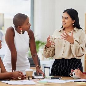 young adults talking in office meeting